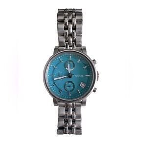 Women’s Fossil watch with beautiful Cyan colored dial with brand new battery .
